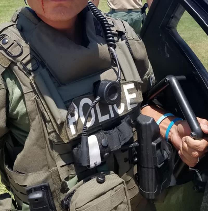 Law enforcement holding his weapon
